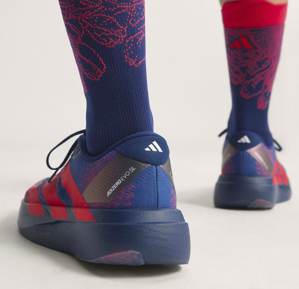 Adizero Evo SL LABRUM Dark Blue Lucid Red