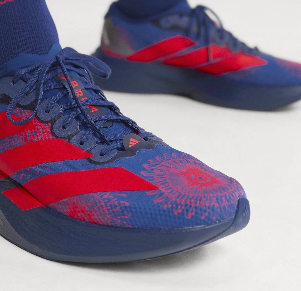Adizero Evo SL LABRUM Dark Blue Lucid Red