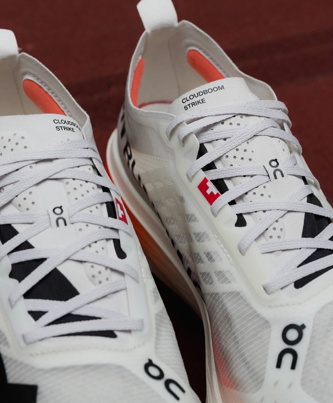 On Running Cloudboom Strike White Black Orange
