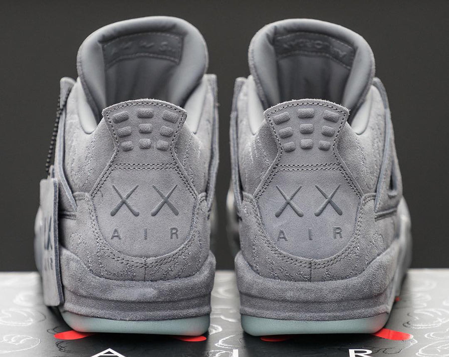 Kaws x Air Jordan 4 Grey ( Glows In Dark )